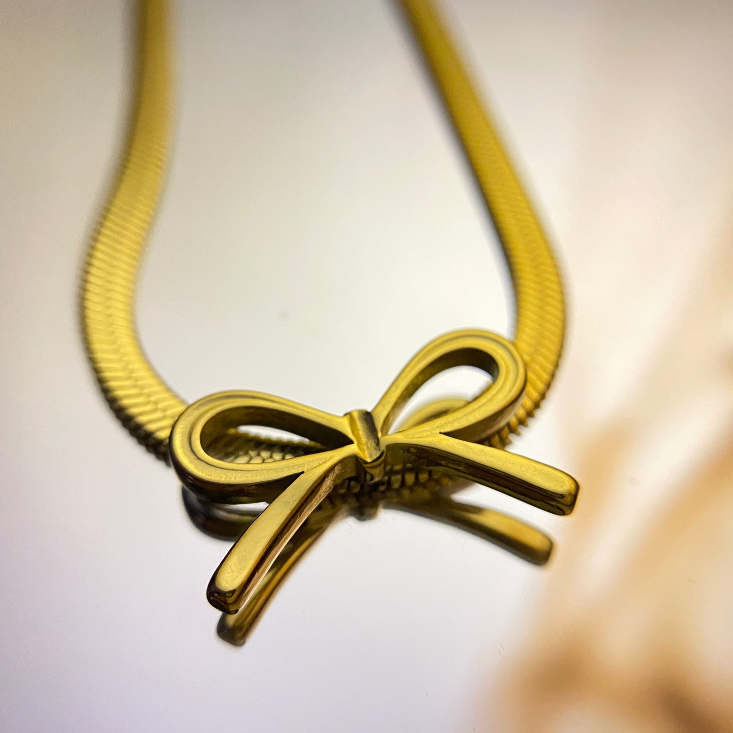 Closeup view of Charm Knot Necklace